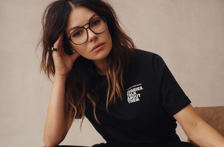 Australian designer Camilla  Freeman-Topper wears an ovarian cancer research t-shirt.